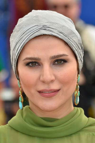 Sahar Dolatshahi turquoise earrings at the Cannes Film Festival in France.